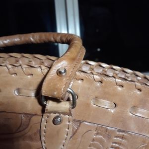 Leather beautifully carved woman handbag